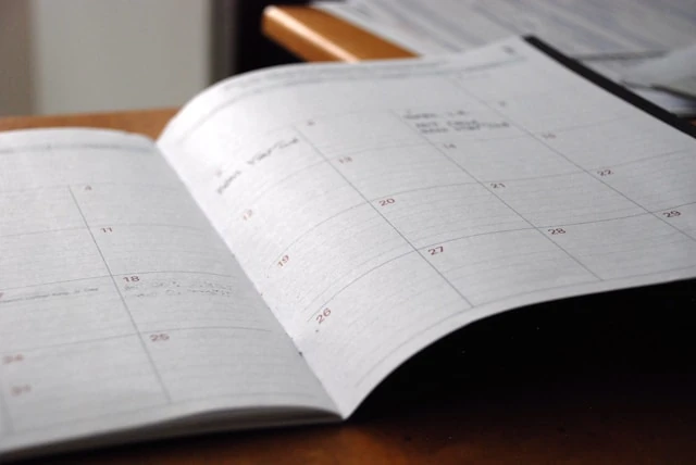 Manager scheduling shifts on a digital tablet